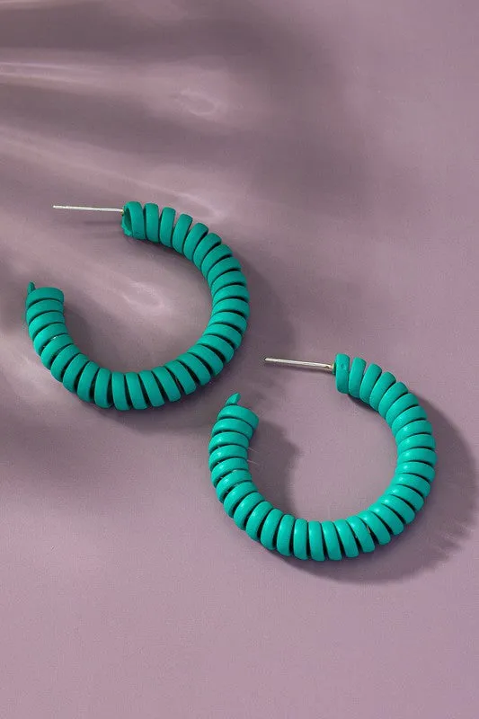 Spiral metal hoop earrings with color coating