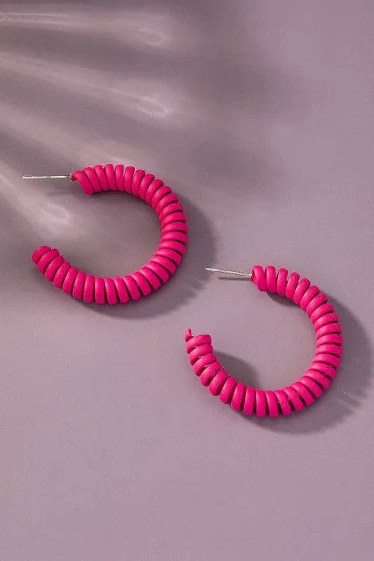 Spiral metal hoop earrings with color coating