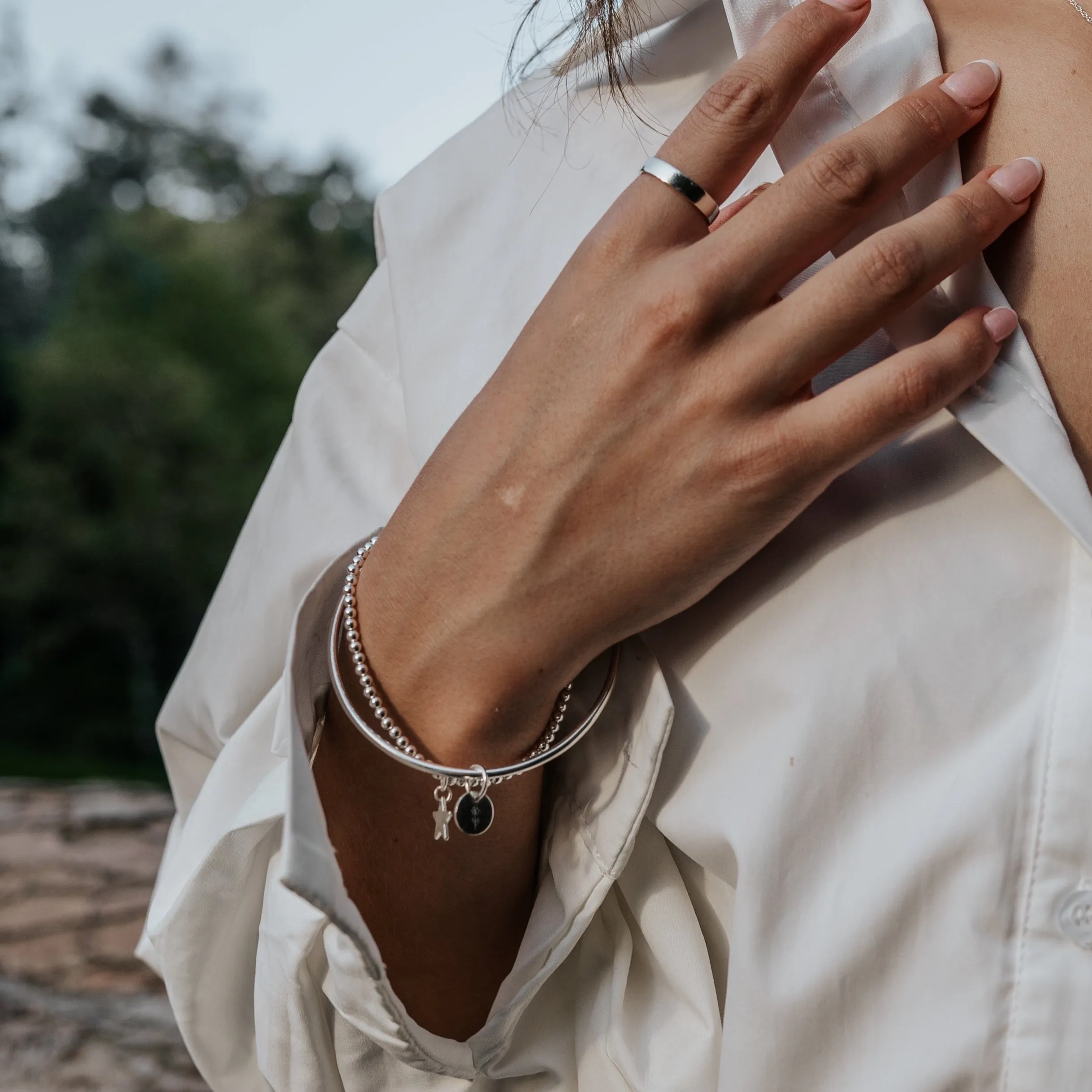 Sterling Silver Bangle with Wave Charm